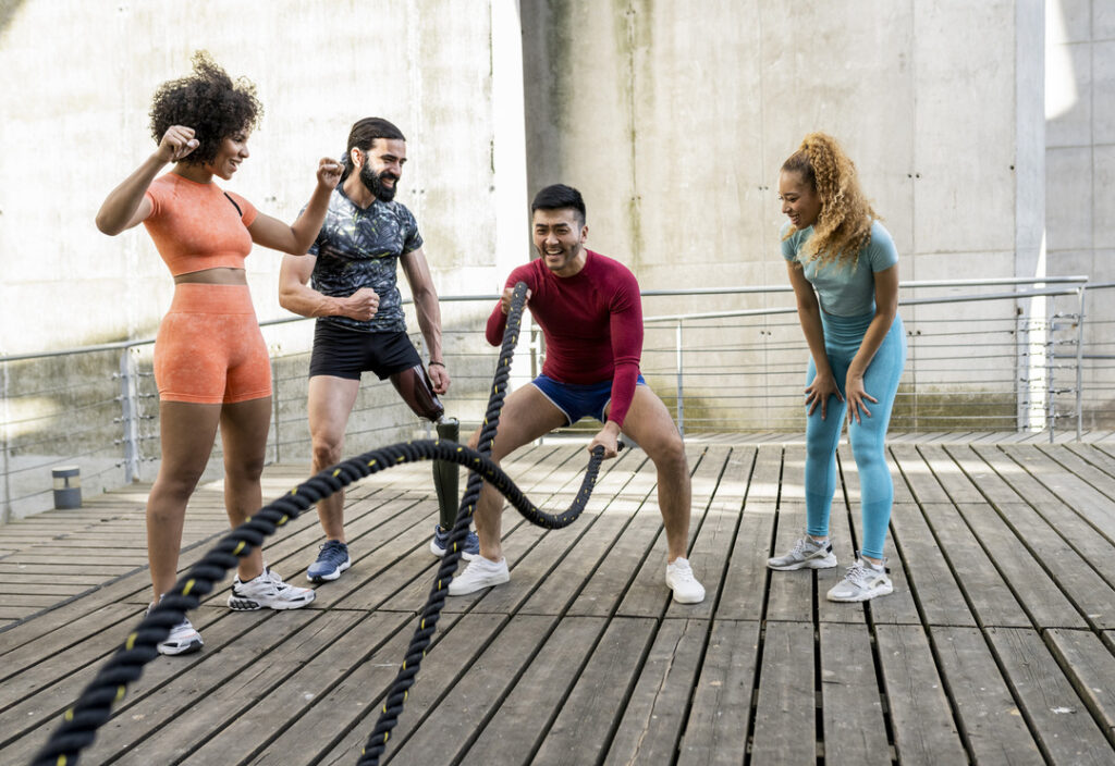 A group of young adults encourage each other during a workout